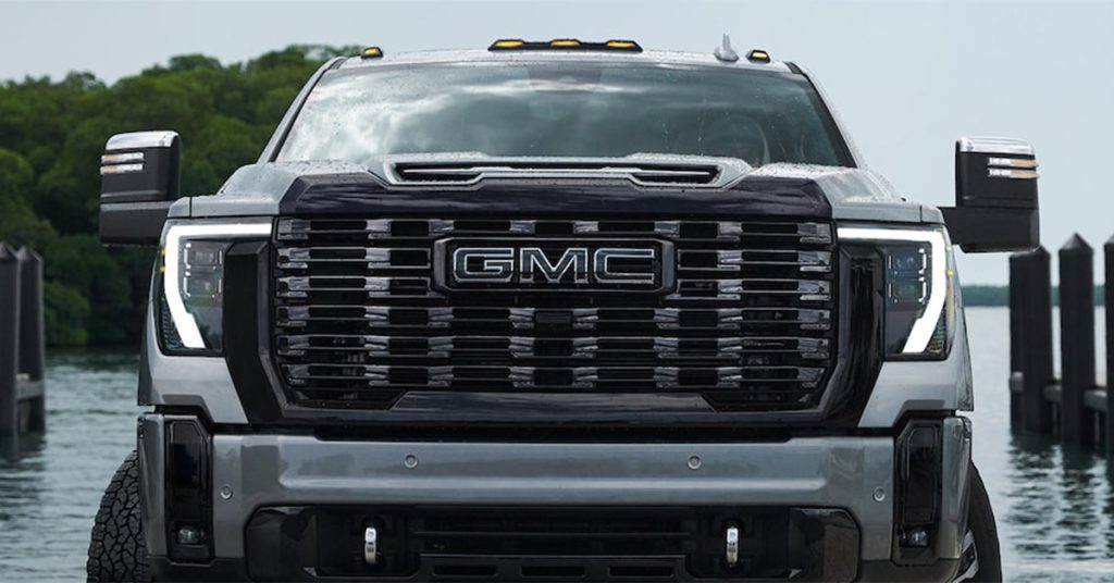 GMC Truck in front of water