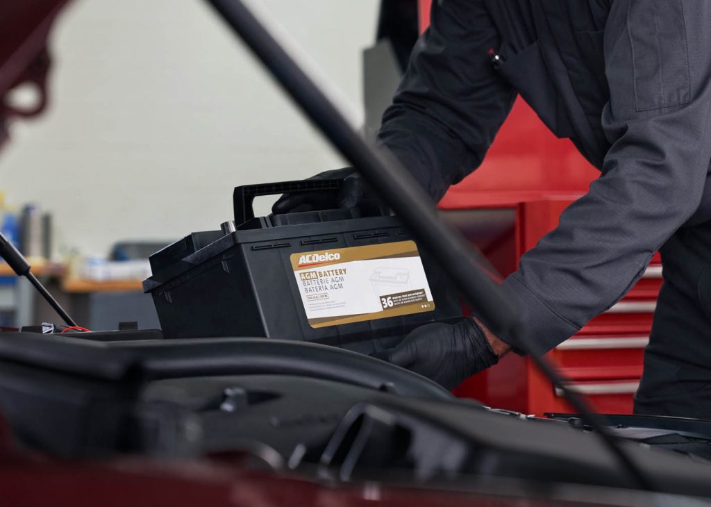 Service Tech replacing a battery